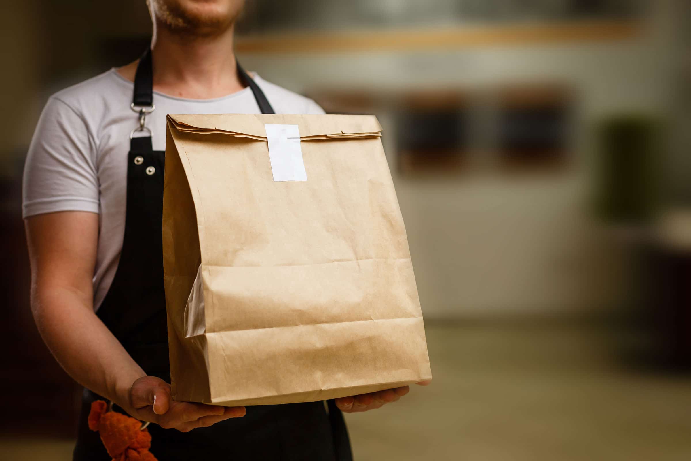 Food Service Sales Growth Employee Delivering Takeout Order